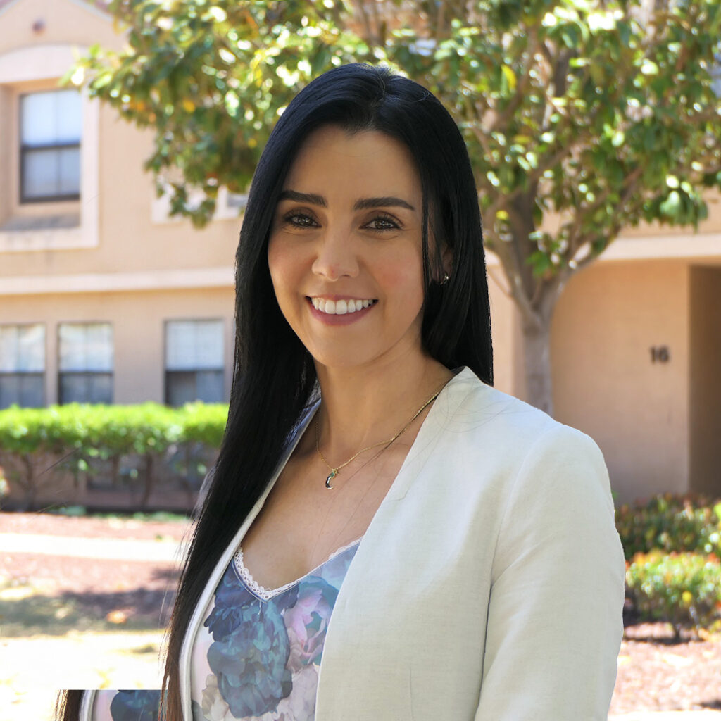 Photo of woman smiling at camera.